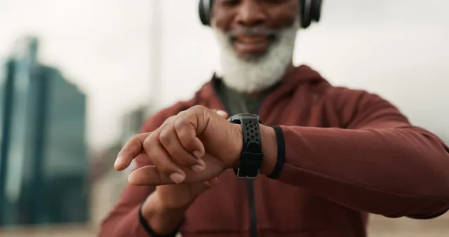A man checking the fitness watch on his wrist